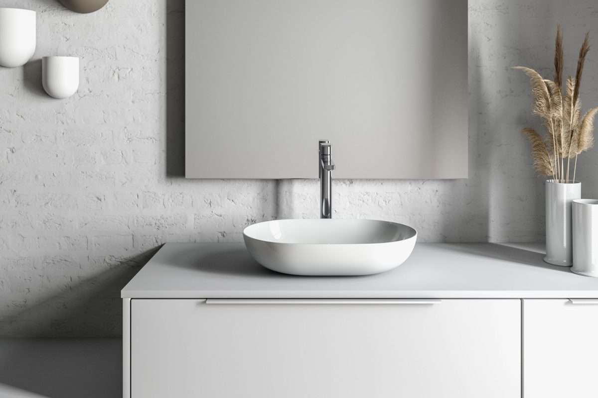 Temal kylpyhuone, jossa rauhallinen tunnelma, harmaa Design-kaluste, valkoinen Aatos-allas, emaliallas, upea valo,